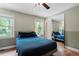 Comfortable bedroom featuring natural light, hard wood floors, and ample closet space, ideal for relaxation at 1109 Buckingham Rd, Garner, NC 27529