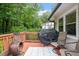 Cozy deck features a grill, fire pit, and seating perfect for outdoor entertaining at 1109 Buckingham Rd, Garner, NC 27529