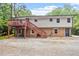 Spacious backyard featuring a two-story home with a deck, and a large gravel area at 1109 Buckingham Rd, Garner, NC 27529