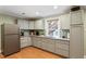Modern kitchen boasts granite countertops, tiled backsplash, and stainless steel appliances at 1109 Buckingham Rd, Garner, NC 27529
