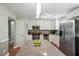 This kitchen features stainless steel appliances, granite counters, and a center island, offering both style and functionality at 1109 Buckingham Rd, Garner, NC 27529