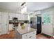 Modern kitchen with stainless steel appliances, granite countertops, and white cabinetry at 1109 Buckingham Rd, Garner, NC 27529