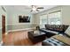 Spacious living room with hardwood floors, a ceiling fan, and plenty of natural light at 1109 Buckingham Rd, Garner, NC 27529