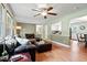 Spacious living room with hardwood floors, a ceiling fan, and plenty of natural light at 1109 Buckingham Rd, Garner, NC 27529