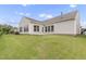 Well-maintained backyard with lush green lawn and a paved patio, perfect for outdoor gatherings and relaxation at 118 Manning Way, Durham, NC 27703