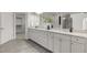 Bathroom featuring double sinks, a granite countertop, and modern tile flooring at 118 Manning Way, Durham, NC 27703