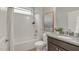 Bathroom featuring a shower-tub combination, neutral paint, and dark granite vanity at 118 Manning Way, Durham, NC 27703