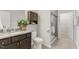 A full bathroom with a granite countertop vanity and shower at 118 Manning Way, Durham, NC 27703