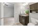 Bright bathroom featuring a granite countertop, undermount sink and medicine cabinet for ample storage at 118 Manning Way, Durham, NC 27703