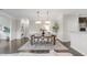 Elegant dining room with pendant lighting, wainscoting, and neutral decor at 118 Manning Way, Durham, NC 27703