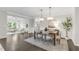 Elegant dining room with pendant lighting, wainscoting, and an open floor plan at 118 Manning Way, Durham, NC 27703