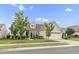 Beautiful one-story home featuring a well-kept lawn, tidy landscaping, and a two-car garage at 118 Manning Way, Durham, NC 27703