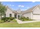 Attractive single-Gathering home with lush landscaping and a welcoming walkway to the front door at 118 Manning Way, Durham, NC 27703