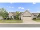 Charming single-story home with a two-car garage, manicured lawn, and mature trees at 118 Manning Way, Durham, NC 27703