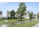 Charming one-story home with a well-maintained lawn, a two-car garage, and manicured landscaping at 118 Manning Way, Durham, NC 27703
