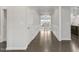 Elegant entryway featuring hardwood floors, white wainscoting, and an open view to the living area at 118 Manning Way, Durham, NC 27703