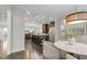 Open concept kitchen with stainless steel appliances and a center island with pendant lighting at 118 Manning Way, Durham, NC 27703