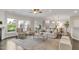 Inviting living room featuring natural light, neutral furniture, and hardwood floors at 118 Manning Way, Durham, NC 27703