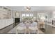 Bright living room with fireplace, built-in shelving, large windows, and neutral decor at 118 Manning Way, Durham, NC 27703