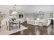 Spacious living area featuring hardwood floors, a fireplace, and seamless flow to the dining area at 118 Manning Way, Durham, NC 27703