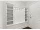 Bright mudroom featuring a built-in bench with storage and hooks providing organization by the entry door at 118 Manning Way, Durham, NC 27703