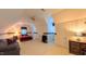 Spacious carpeted bedroom featuring a ceiling fan, a sofa, and two closets for ample storage space at 119 Georgetowne Dr, Elon, NC 27244