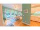 Sun-drenched breakfast nook with large windows and cozy seating area at 119 Georgetowne Dr, Elon, NC 27244