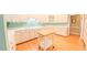 Modern kitchen featuring abundant counter space, a center island, and sleek white cabinetry at 119 Georgetowne Dr, Elon, NC 27244