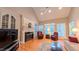 Cozy living room features a fireplace, vaulted ceiling, and hardwood floors at 119 Georgetowne Dr, Elon, NC 27244