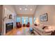 Spacious living room with fireplace, hardwood floors, and natural light at 119 Georgetowne Dr, Elon, NC 27244