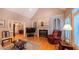 Bright living room with fireplace and hardwood floors at 119 Georgetowne Dr, Elon, NC 27244
