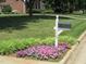 Charming mailbox with address number and surrounding flowerbed at 119 Georgetowne Dr, Elon, NC 27244