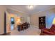 Well-lit office space featuring a classic wooden desk and bookcase at 119 Georgetowne Dr, Elon, NC 27244