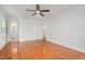 Bedroom with neutral paint, wood flooring, ceiling fan, and natural light at 12 Striding Ridge Ct, Durham, NC 27713