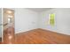Bright bedroom with hardwood floors, a window with views, and a double-door closet at 12 Striding Ridge Ct, Durham, NC 27713