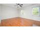 Bedroom with neutral paint, wood flooring, and a ceiling fan at 12 Striding Ridge Ct, Durham, NC 27713