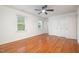 Bedroom with neutral paint, wood flooring, ceiling fan, and natural light at 12 Striding Ridge Ct, Durham, NC 27713