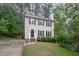 Traditional two-story home featuring a well-manicured lawn, black shutters and a welcoming front entrance at 12 Striding Ridge Ct, Durham, NC 27713