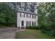 Charming two-story home with a well-manicured lawn, black shutters, and a welcoming front entrance at 12 Striding Ridge Ct, Durham, NC 27713