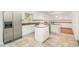 Bright kitchen features an island with butcher block top and stainless appliances at 12 Striding Ridge Ct, Durham, NC 27713