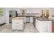 Bright kitchen features an island with butcher block top and stainless appliances at 12 Striding Ridge Ct, Durham, NC 27713
