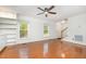 Inviting living room boasts hardwood floors, neutral walls, a staircase and natural light streaming in from windows at 12 Striding Ridge Ct, Durham, NC 27713