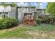 Home exterior showcasing a backyard with a deck, green grass and lush landscaping at 120 Jo Anne Cir, Cary, NC 27513