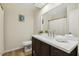 Bathroom featuring a double vanity with a white countertop, and a mirror that spans the length of the countertop at 120 Jo Anne Cir, Cary, NC 27513