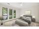 Bedroom featuring carpet, ceiling fan, and large bed at 120 Jo Anne Cir, Cary, NC 27513
