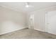 Comfortable bedroom showcasing neutral carpet, bright white trim, and access to a closet at 120 Jo Anne Cir, Cary, NC 27513