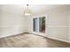 Dining room with modern flooring and double doors to outdoor deck area at 120 Jo Anne Cir, Cary, NC 27513