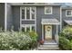 Charming two-story home with blue siding, well-maintained landscaping, and inviting front porch at 120 Jo Anne Cir, Cary, NC 27513