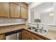 Kitchen featuring stainless steel appliances, wood cabinets and double sink at 120 Jo Anne Cir, Cary, NC 27513