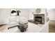 Staged living room features stone fireplace, modern flooring and contemporary decor at 120 Jo Anne Cir, Cary, NC 27513